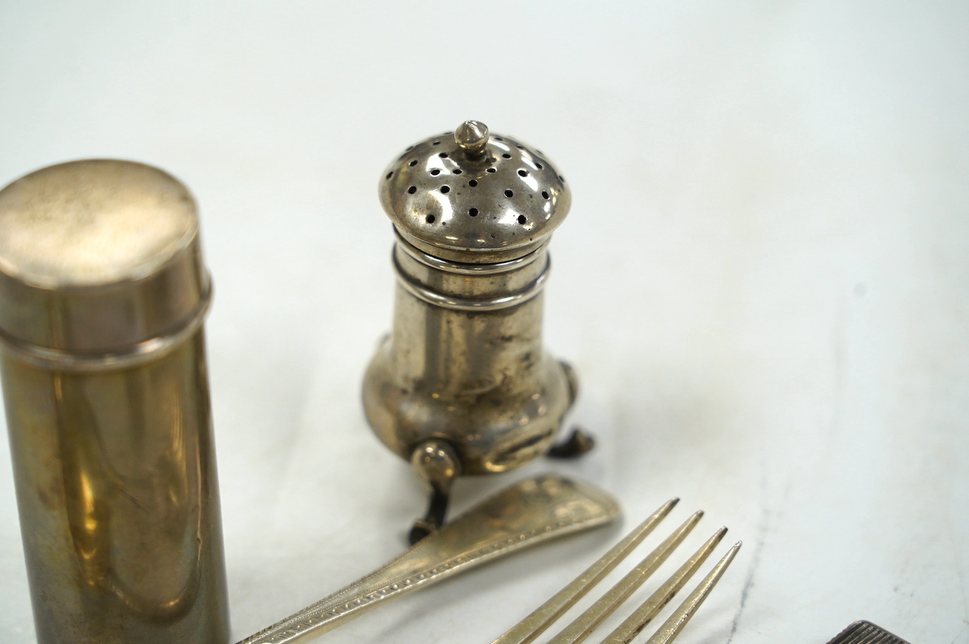A group of small silver, including a George IV vinaigrette, shaving brush holder, etc. and a Dutch white metal snuff box. Condition - poor to fair